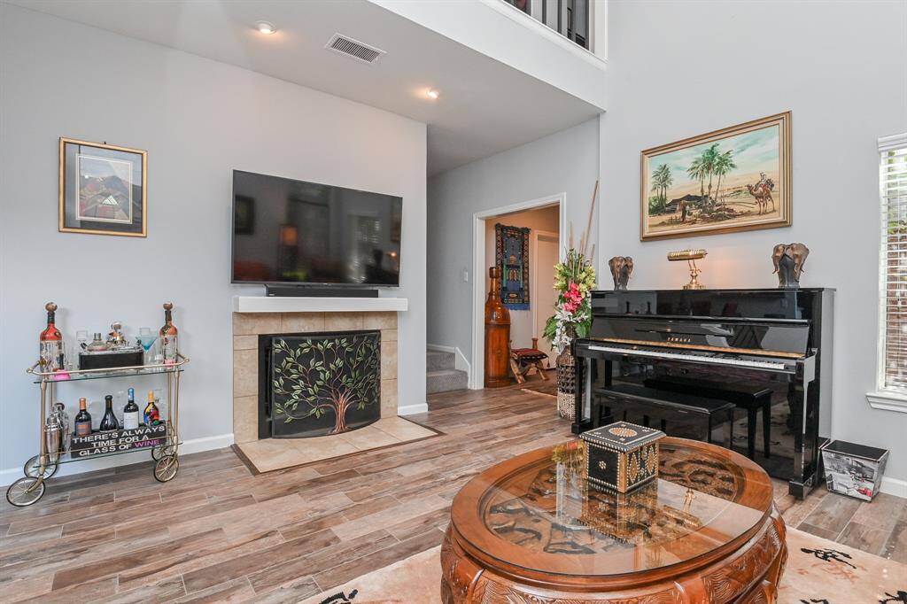 The family room has a wood-burning fireplace.