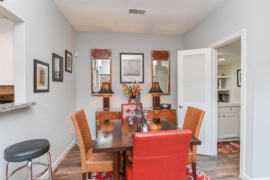 A view of dining room with a look into butlers pantry.