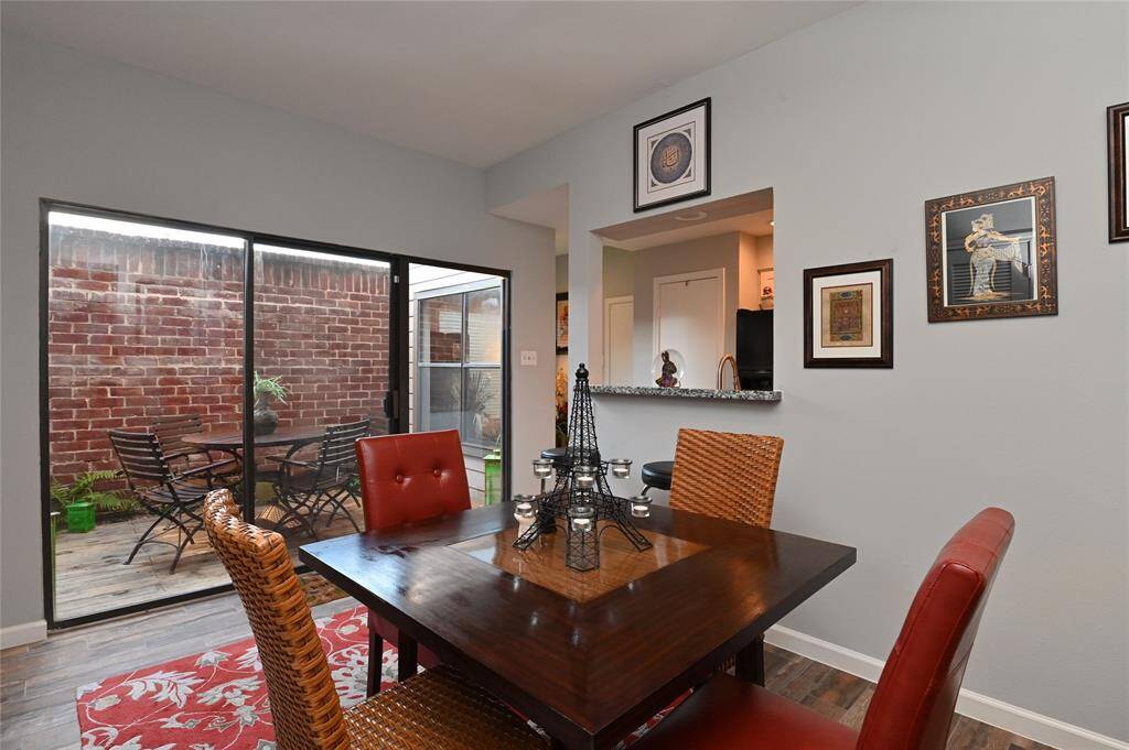 Another view of dining room looking out to atrium and into kitchen.