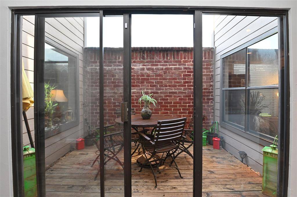 The atrium offers privacy, natural light and perfect place for enjoying a nice meal.