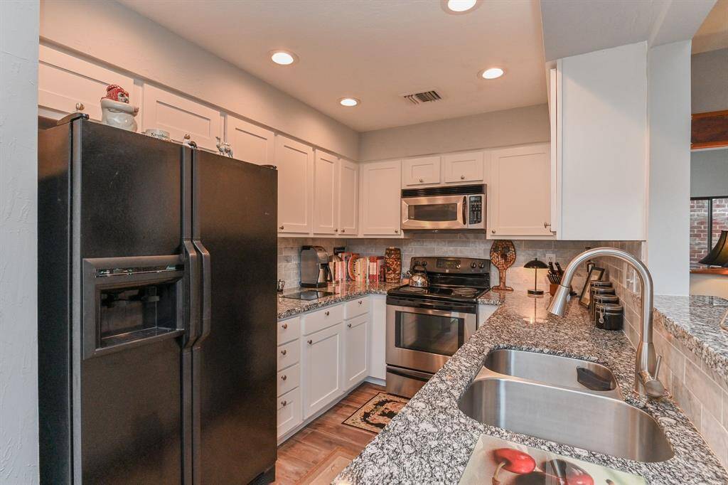 This kitchen is very spacious with lots of storage.