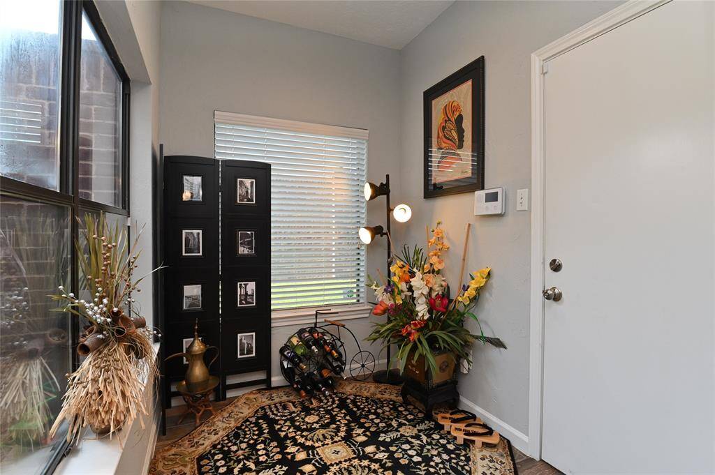 The room could be used as a breakfast area and adjacent to the kitchen. Door on the right leads to garage.