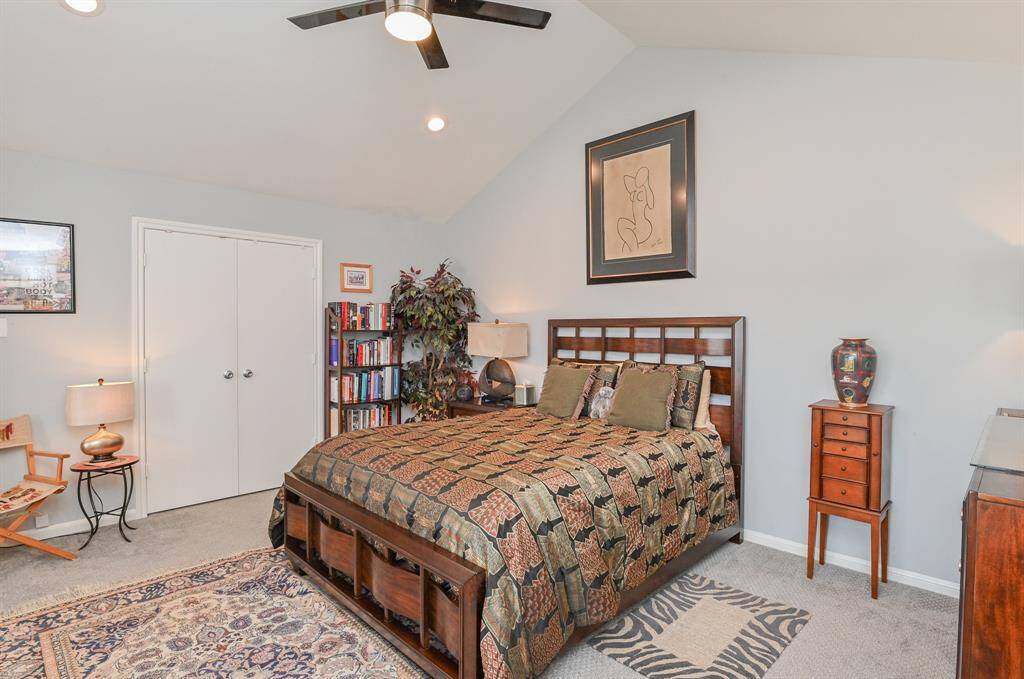 Master bedroom is spacious with walk-in closet and vaulted ceiling.