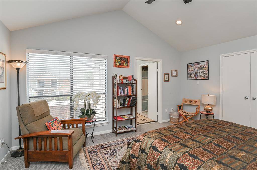 The large window provides natural lighting for the master bedroom.
