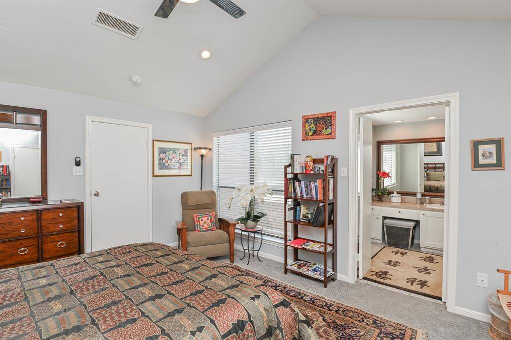 This view shows bedroom door on left and a peak into the master bath.