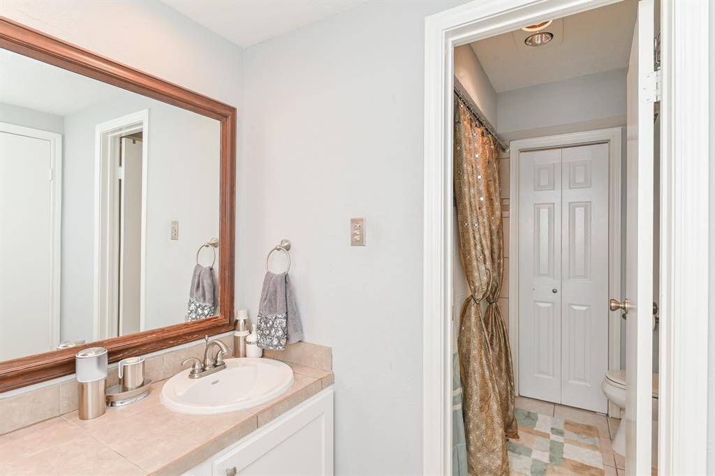 This door leads to tub/shower and commode. The door in the background leads to the bonus room.