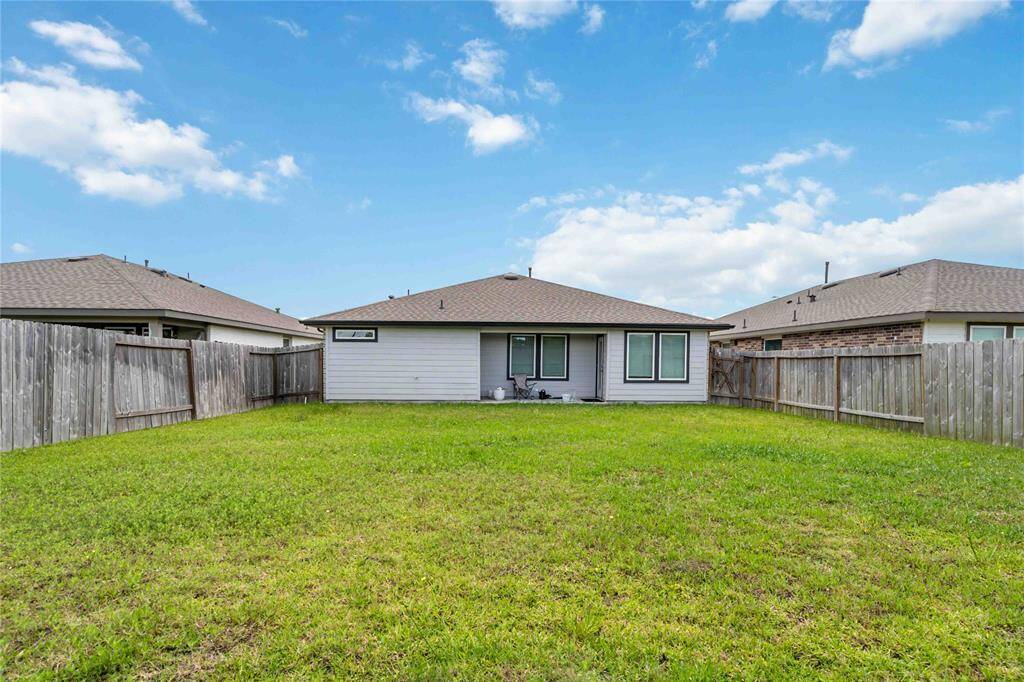 Beautiful backyard with lush greenery, patio space, and room for outdoor enjoyment.