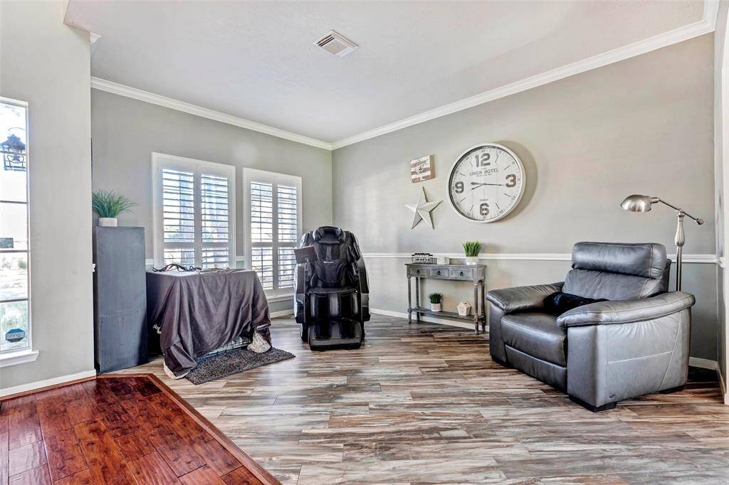 Versatile open room off the entry, perfect for an office, reading nook, or creative space.