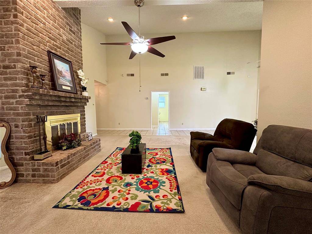 Exposed Brick Fireplace and Ceiling Fan