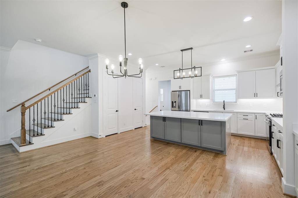 Brightly lit kitchen with undercounter lighting
