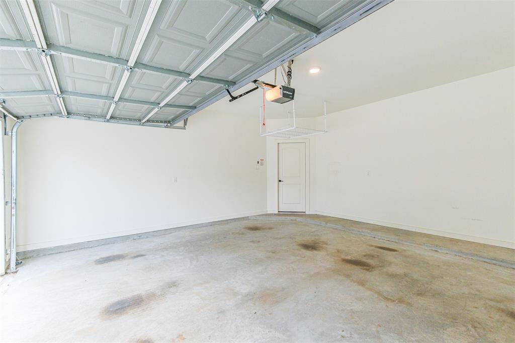 Garage has above storage rack