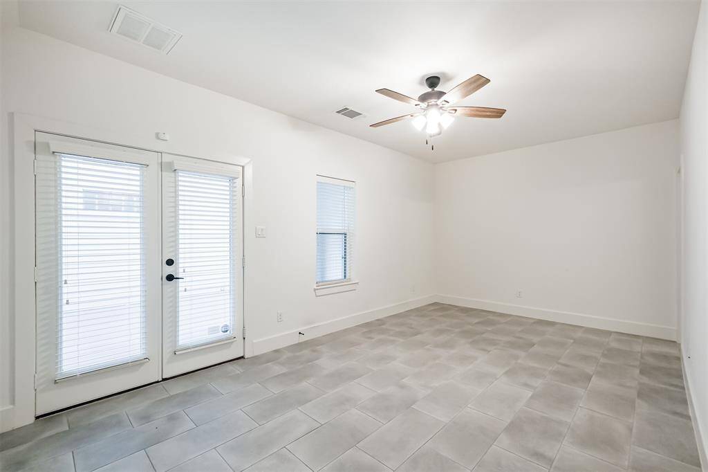 First floor bedroom is extra large and leads out to the private patio.  Full bathroom door to the right