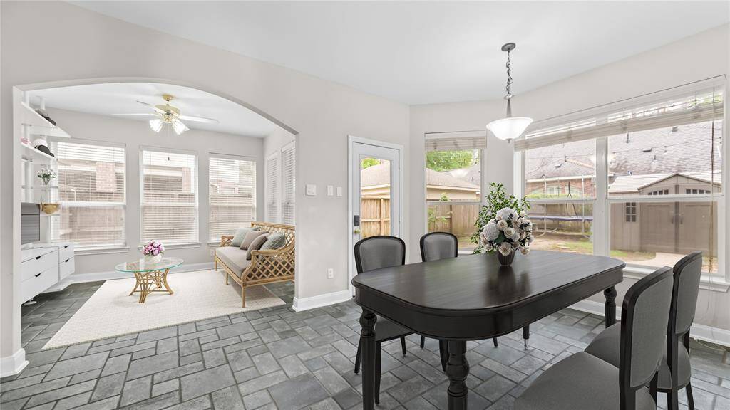 Breakfast area with flex room virtually staged.